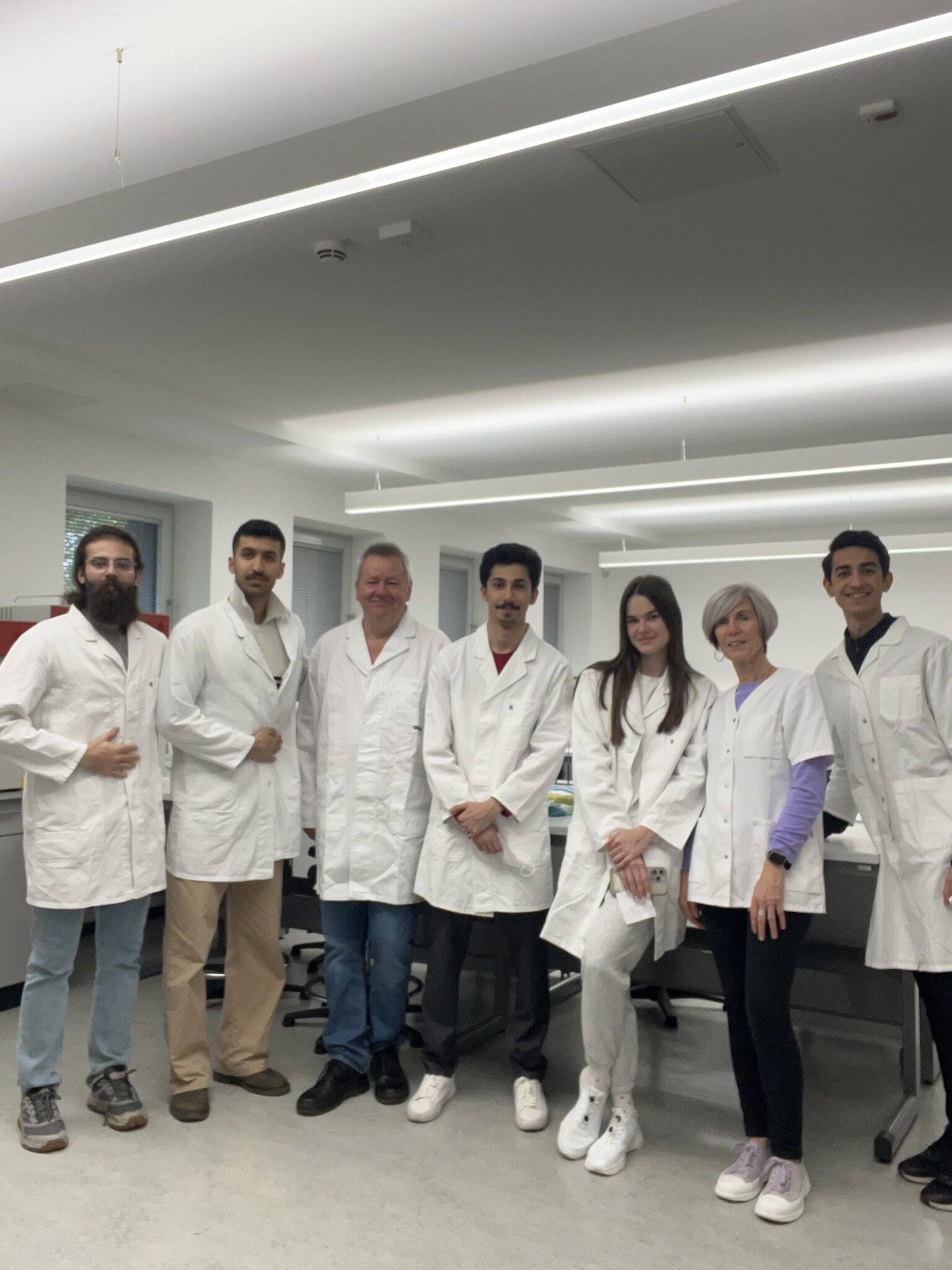 Group in lab coats in the lab