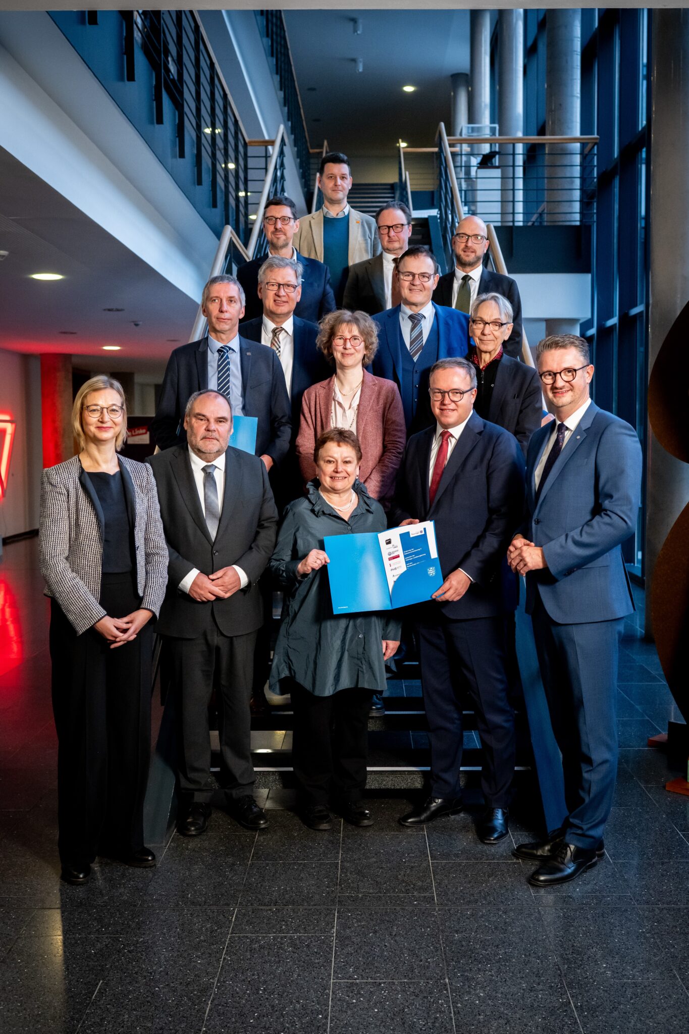 Group photo of people on stairs.