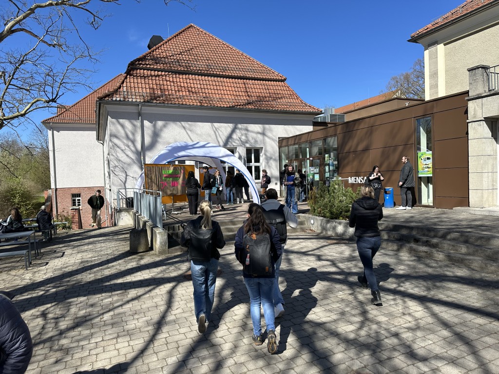 People in front of an outdoor building