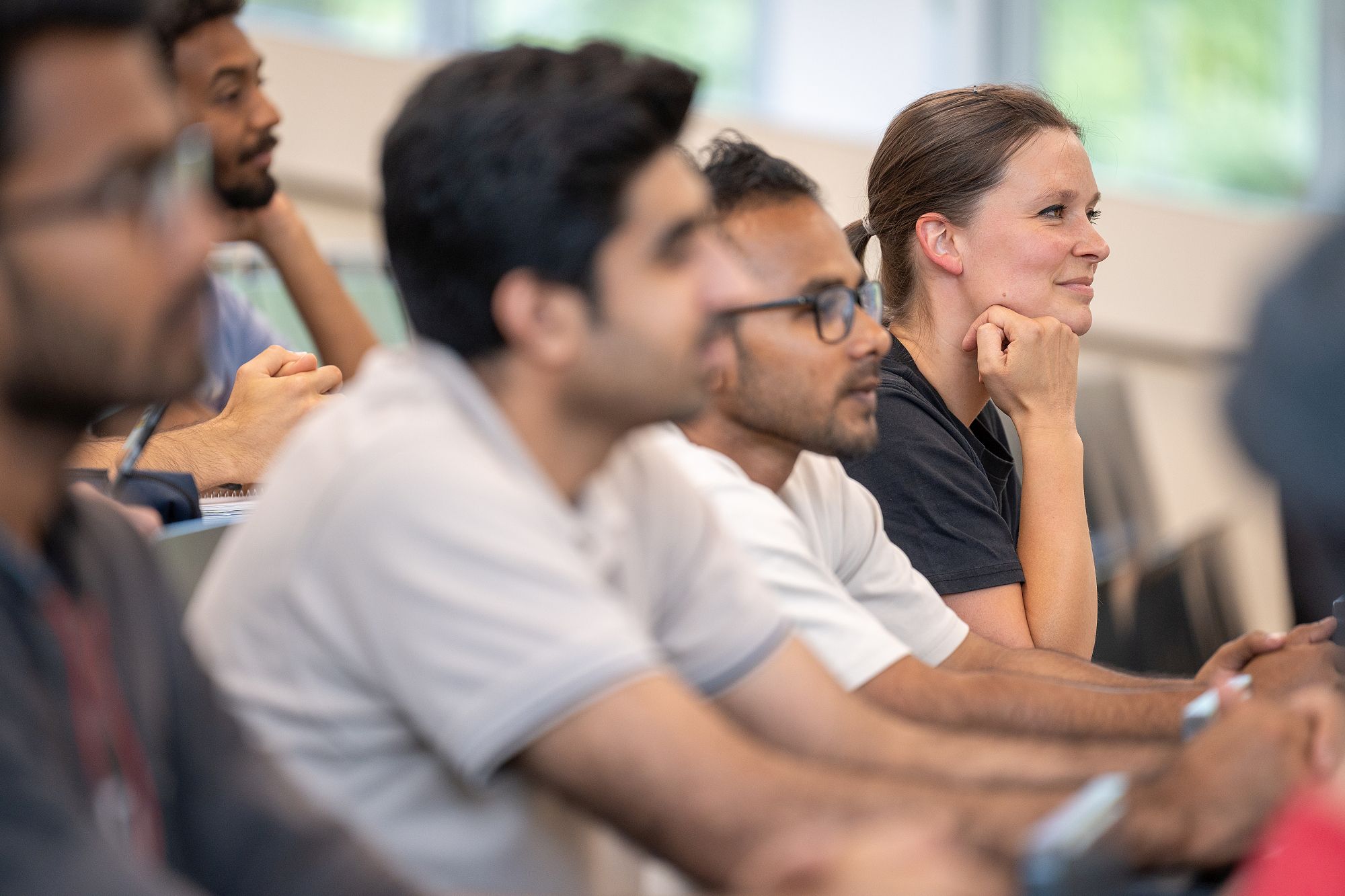 Students listen attentively.